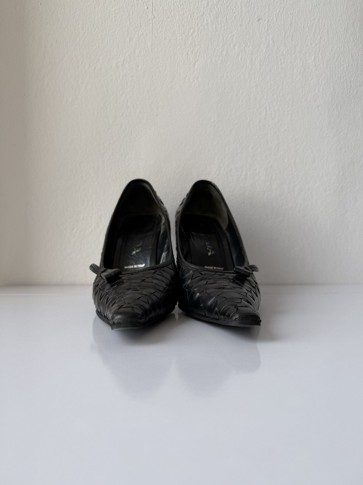 Prada woven leather long toe pumps with bow