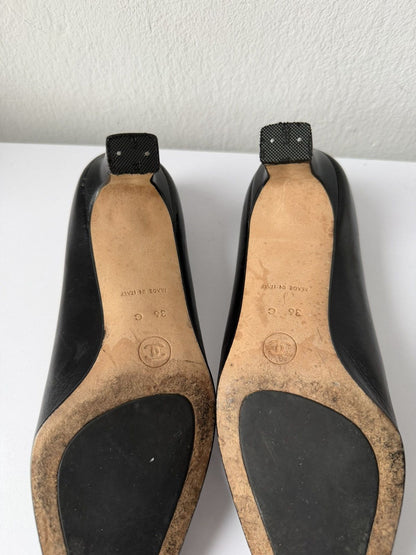 AW2001 Chanel embossed logo long toe leather pumps