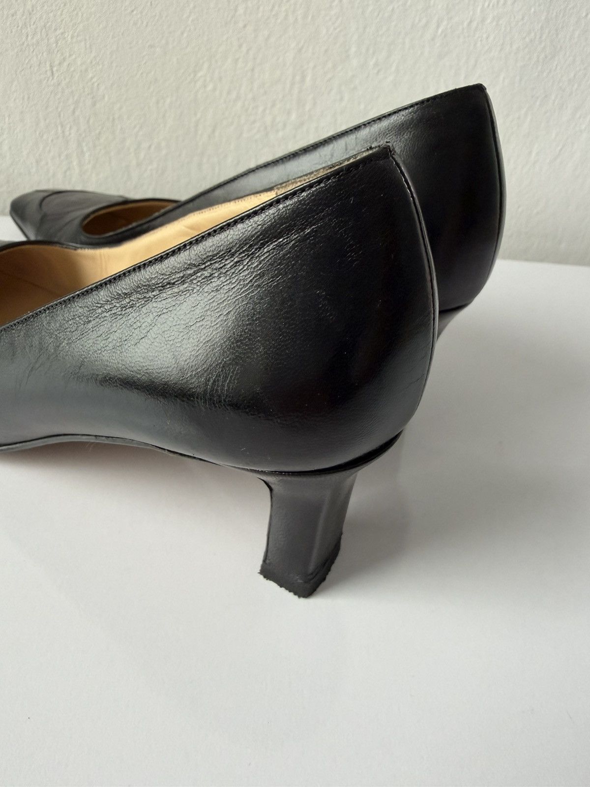 AW2001 Chanel embossed logo long toe leather pumps