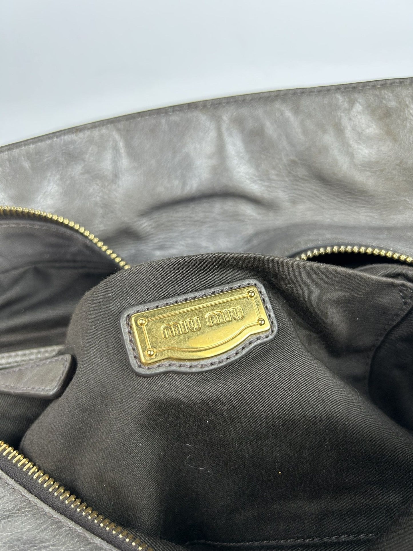 Miu miu vitello bow bag in gray with locket