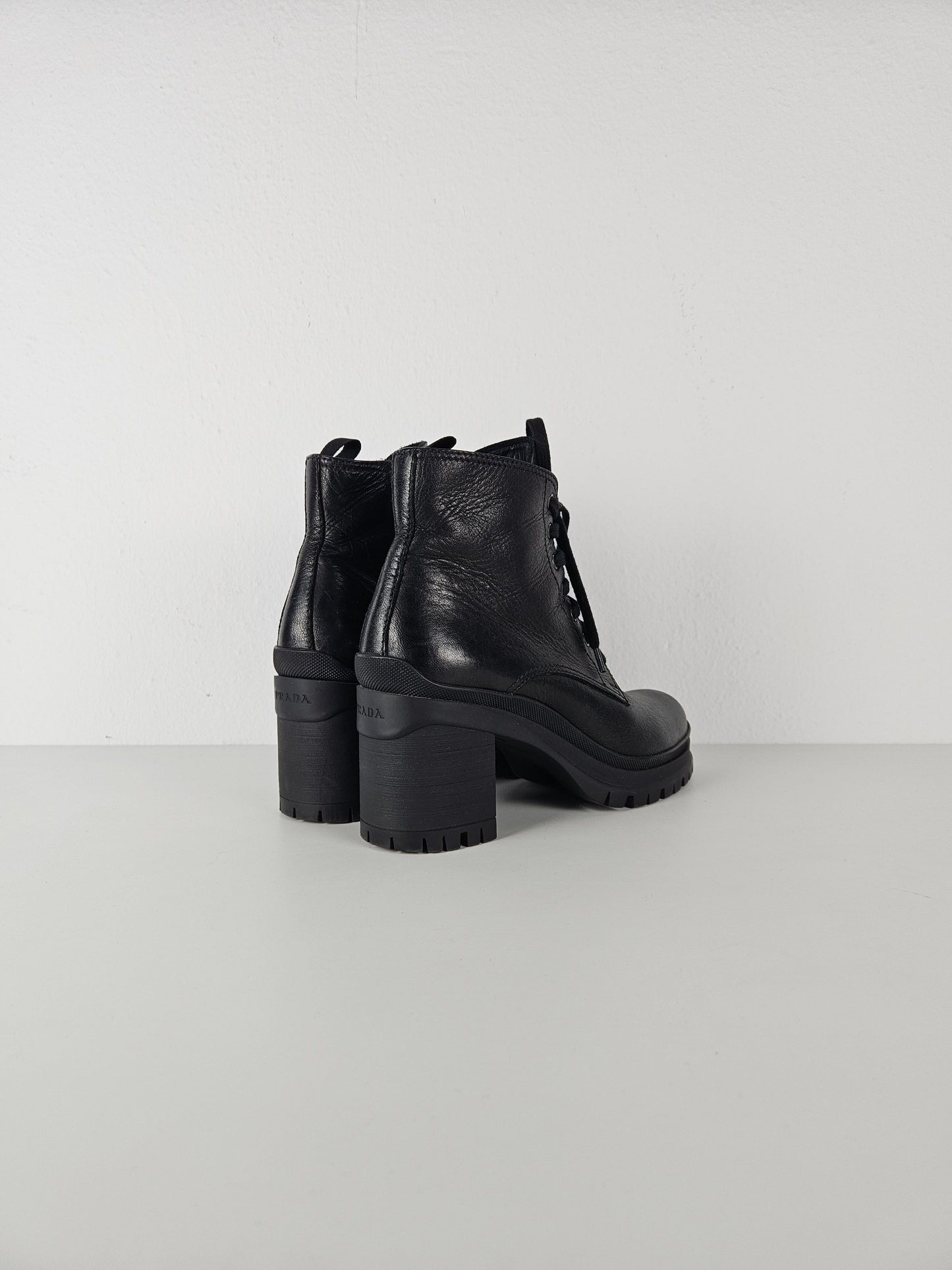 Prada lace up block heel notched sole ankle boots