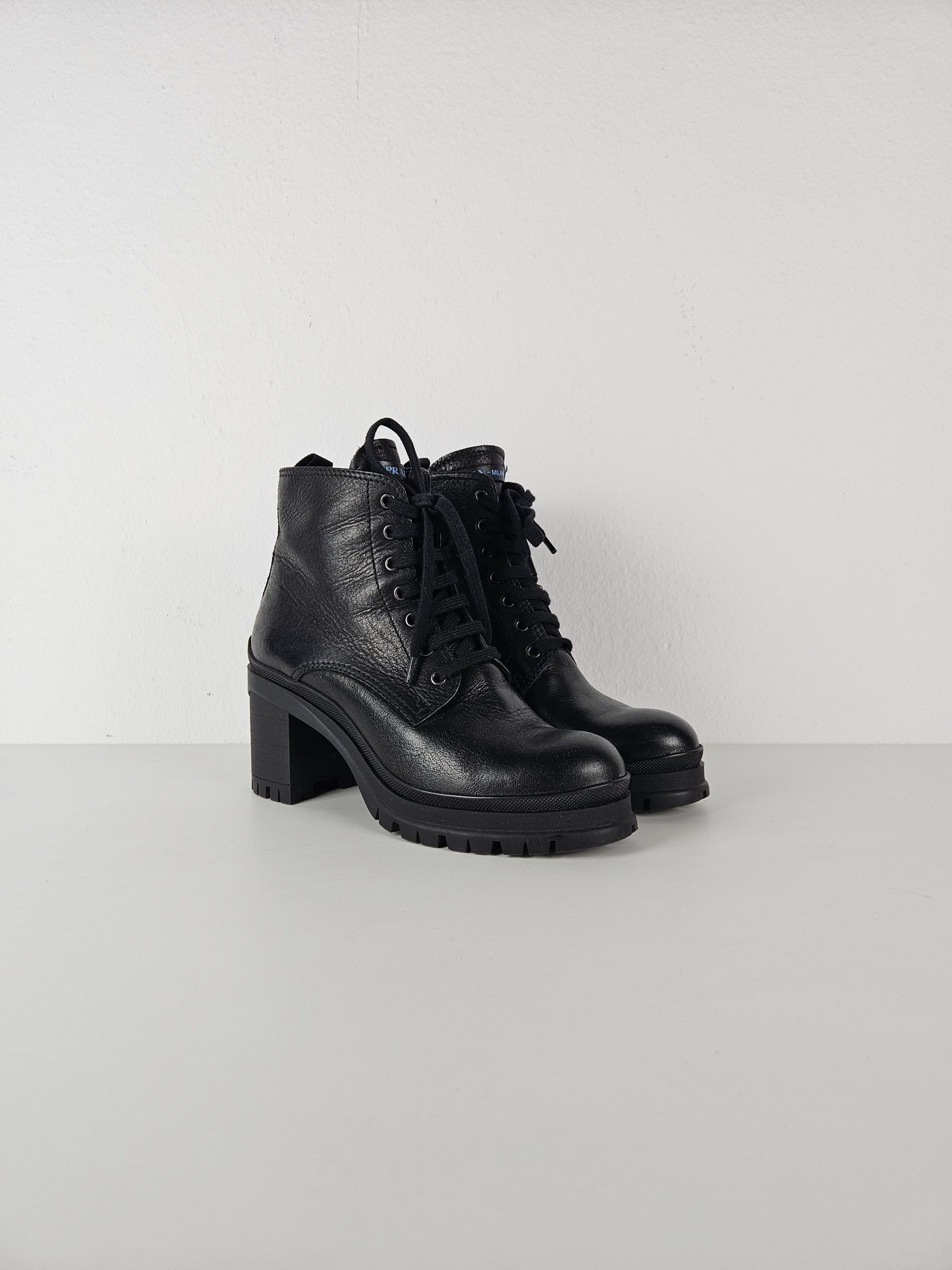 Prada lace up block heel notched sole ankle boots